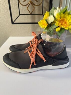 OluKai's Miki Li Black with Orange Laces sneakers